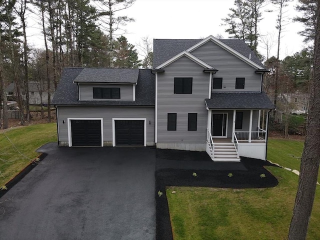 view of front of house with a garage, a front lawn, covered porch, a shingled roof, and driveway