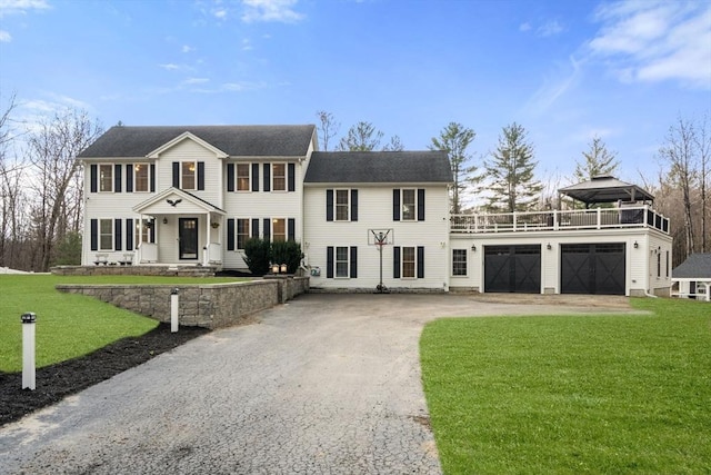 2 Britlees Way, Dudley, MA 01571 - colonial inspired home with driveway, a garage, a front yard, and a balcony