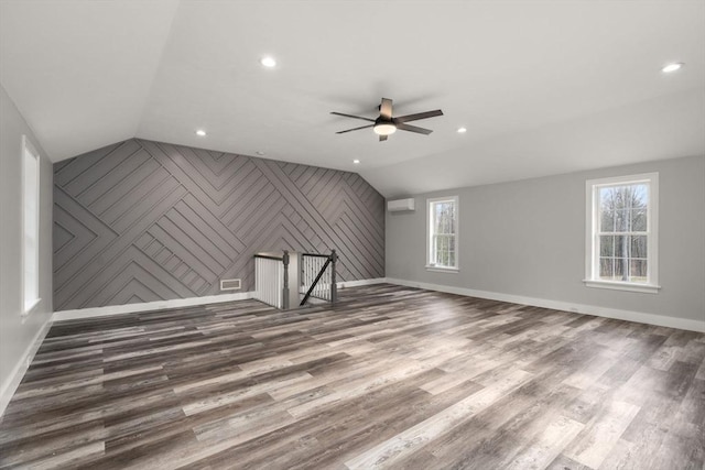 2 Britlees Way, Dudley, MA 01571 - bonus room with lofted ceiling, wood finished floors, ceiling fan, recessed lighting, and an accent wall