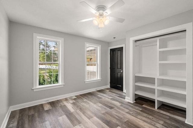 2 Britlees Way, Dudley, MA 01571 - unfurnished bedroom with wood finished floors, a closet, and a ceiling fan