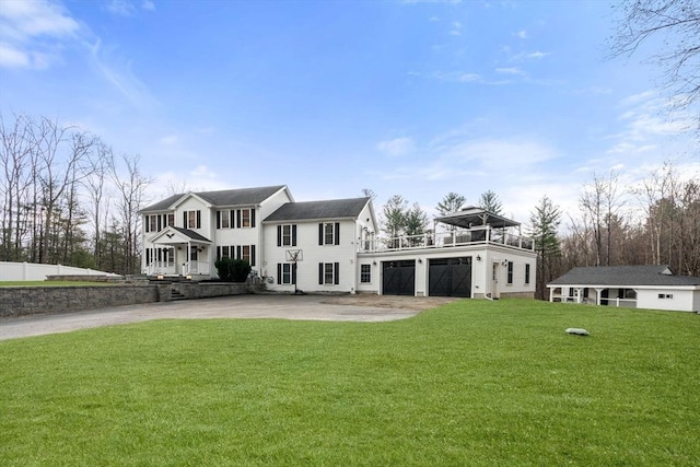 2 Britlees Way, Dudley, MA 01571 - back of property with concrete driveway, a balcony, and a yard