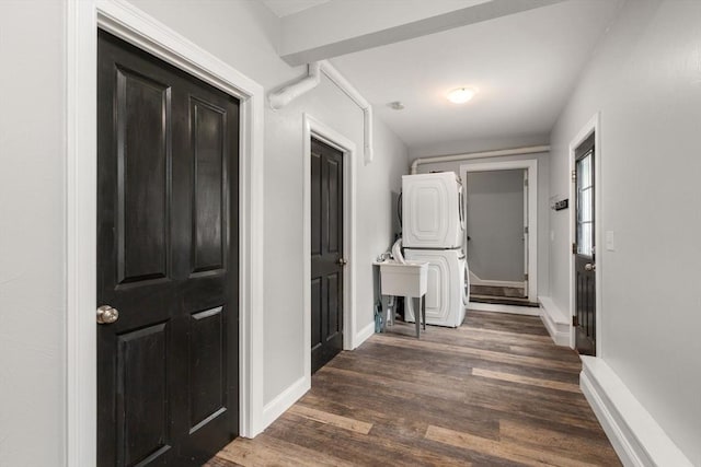 2 Britlees Way, Dudley, MA 01571 - corridor with stacked washer / drying machine and dark wood-style flooring