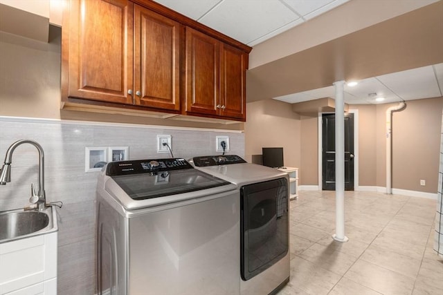 2 Britlees Way, Dudley, MA 01571 - washroom with separate washer and dryer, cabinet space, and light tile patterned floors