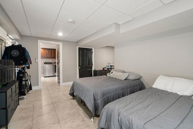 2 Britlees Way, Dudley, MA 01571 - bedroom featuring a paneled ceiling, light tile patterned floors, and washer / clothes dryer