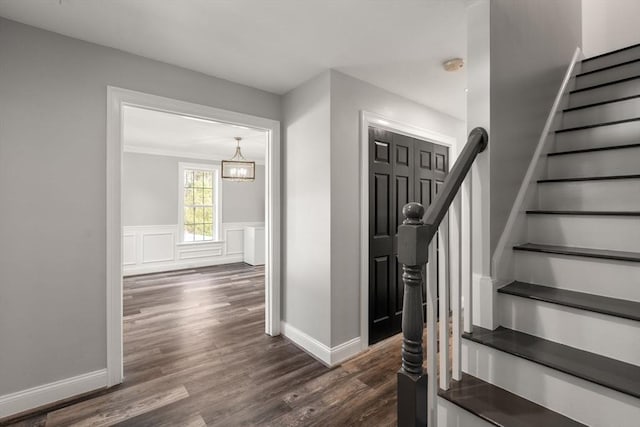2 Britlees Way, Dudley, MA 01571 - stairs featuring wood finished floors, a chandelier, and a wainscoted wall
