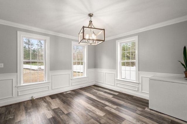 2 Britlees Way, Dudley, MA 01571 - unfurnished dining area featuring a chandelier, wainscoting, crown molding, and dark wood-style flooring