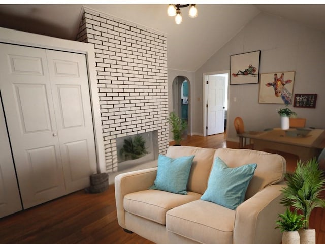 living room featuring lofted ceiling, dark wood-style flooring, and arched walkways