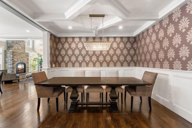 dining room featuring beam ceiling, wainscoting, and wallpapered walls