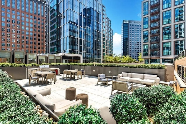 135 Seaport Blvd Unit 1901, Boston, MA 02210 - view of home's community featuring outdoor lounge area, a city view, and a patio area