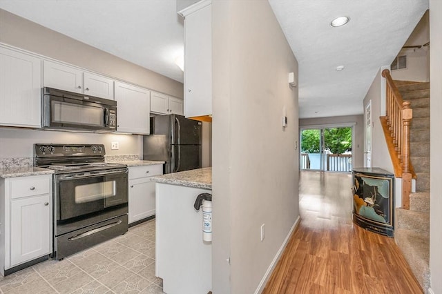 2 Steeplechase Ct Unit 2, Haverhill, MA 01832 - kitchen featuring black appliances, white cabinets, baseboards, light stone countertops, and recessed lighting
