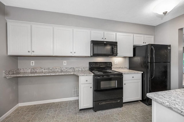 2 Steeplechase Ct Unit 2, Haverhill, MA 01832 - kitchen with black appliances, baseboards, white cabinets, and light stone countertops