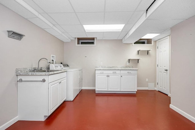 2 Steeplechase Ct Unit 2, Haverhill, MA 01832 - kitchen featuring a sink, independent washer and dryer, finished concrete floors, baseboards, and a drop ceiling