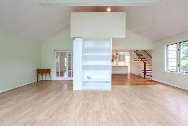 44 Huntington Ave, Sharon, MA 02067 - unfurnished living room featuring stairway, wood finished floors, high vaulted ceiling, and baseboards
