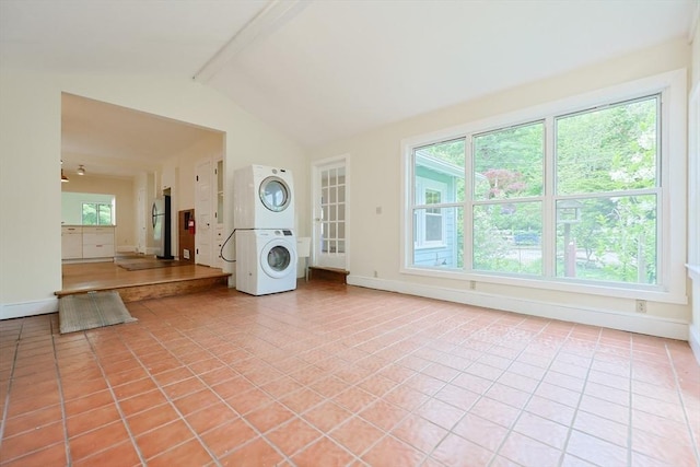 44 Huntington Ave, Sharon, MA 02067 - unfurnished living room with stacked washer / drying machine, light tile patterned floors, and baseboards