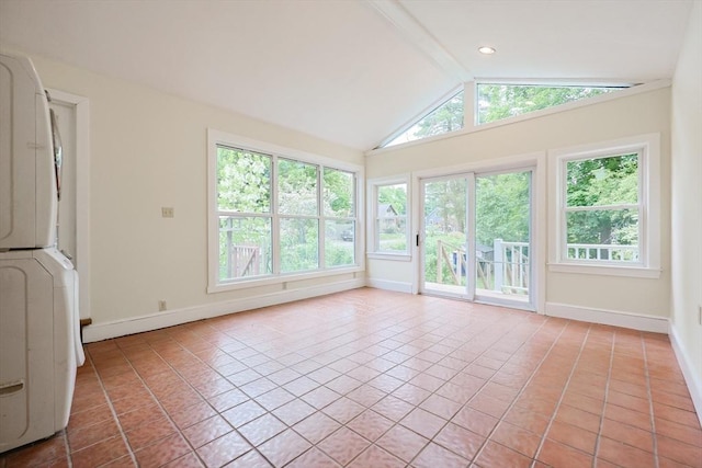 44 Huntington Ave, Sharon, MA 02067 - unfurnished sunroom featuring stacked washer and clothes dryer, lofted ceiling, baseboards, and tile patterned floors