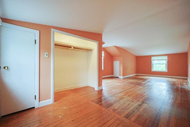 44 Huntington Ave, Sharon, MA 02067 - unfurnished bedroom with hardwood / wood-style floors, lofted ceiling, a closet, and baseboards
