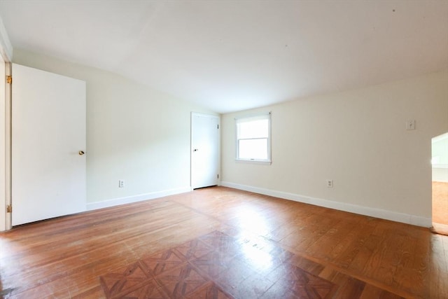 44 Huntington Ave, Sharon, MA 02067 - unfurnished room featuring vaulted ceiling, baseboards, and parquet flooring