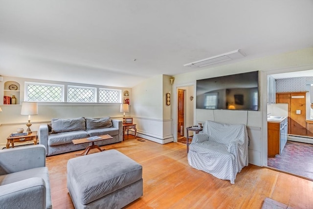 575 Nauset Rd, Eastham, MA 02642 - living area featuring light wood-style flooring and a baseboard heating unit