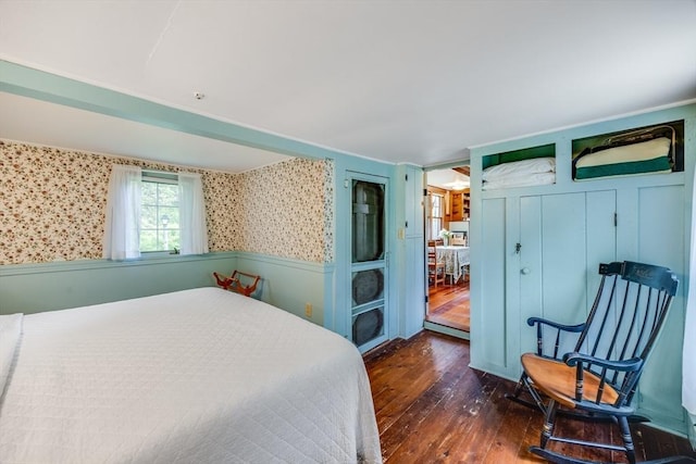 575 Nauset Rd, Eastham, MA 02642 - bedroom featuring dark wood-style flooring, wainscoting, and wallpapered walls