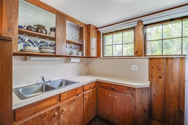 575 Nauset Rd, Eastham, MA 02642 - kitchen with a sink, light countertops, and brown cabinetry