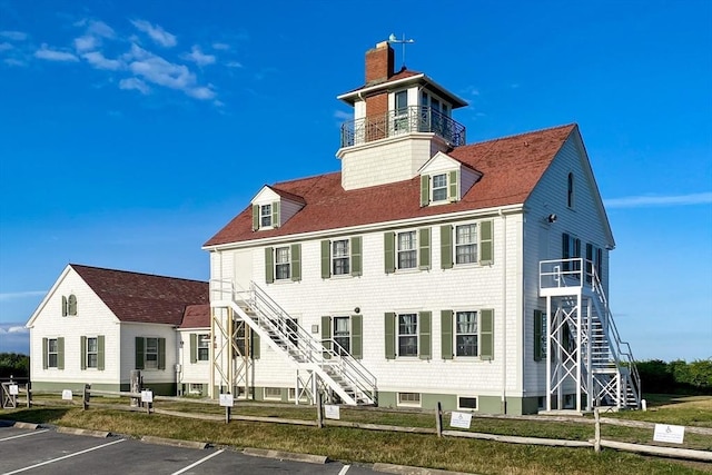 575 Nauset Rd, Eastham, MA 02642 - view of building exterior with stairs and uncovered parking