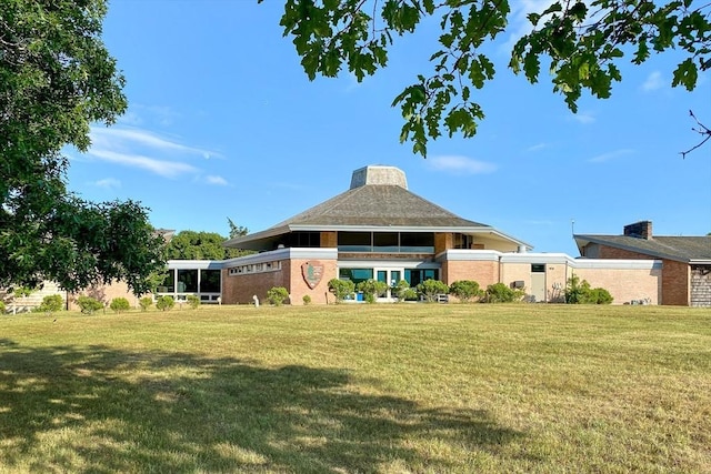 575 Nauset Rd, Eastham, MA 02642 - back of house with a lawn and brick siding
