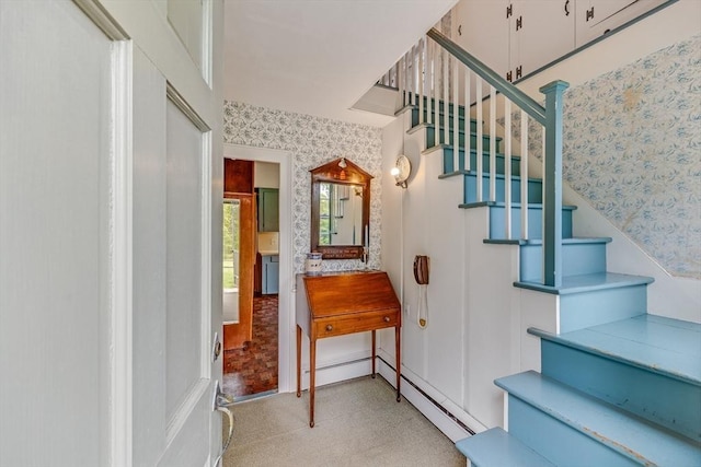 575 Nauset Rd, Eastham, MA 02642 - stairs with wallpapered walls, a baseboard heating unit, and tile patterned floors