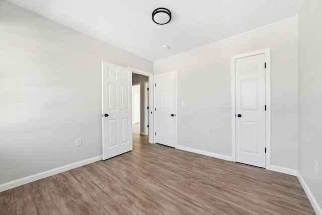 unfurnished bedroom featuring hardwood / wood-style floors