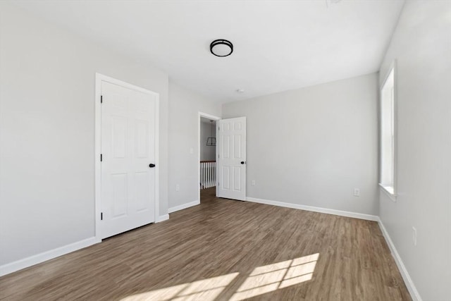 unfurnished bedroom featuring hardwood / wood-style floors