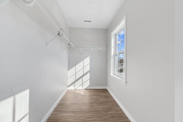 walk in closet featuring hardwood / wood-style floors