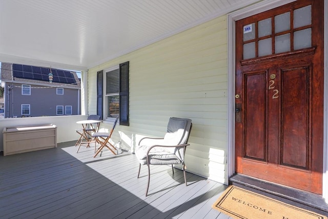 wooden terrace with a porch