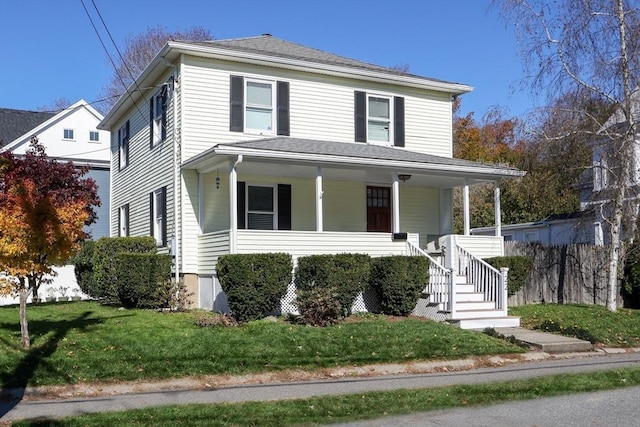 view of front of house featuring a porch and a front yard