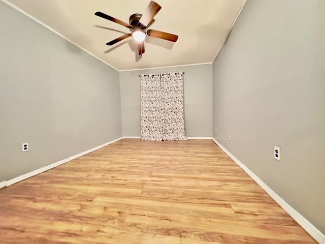 spare room featuring ceiling fan, light hardwood / wood-style floors, and crown molding