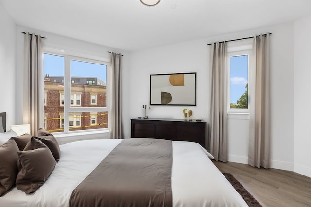 bedroom with light hardwood / wood-style flooring