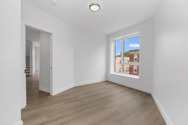 empty room with light wood-type flooring