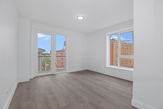 spare room featuring hardwood / wood-style floors