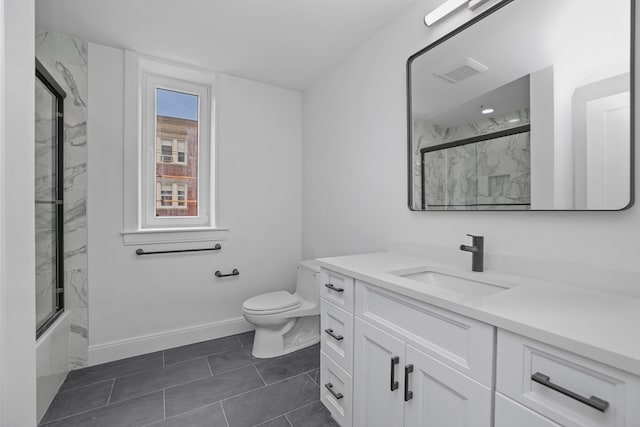 full bathroom featuring combined bath / shower with glass door, vanity, toilet, and tile patterned flooring