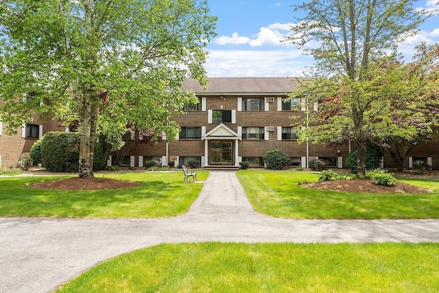 45 Macy St Unit B-205, Amesbury, MA 01913 - view of front of property with a front yard and brick siding