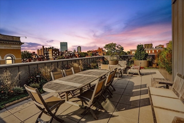 view of patio terrace at dusk