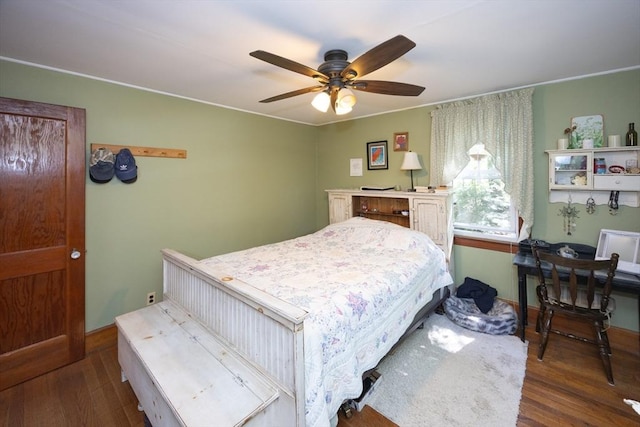 bedroom with wood finished floors, baseboards, and ceiling fan