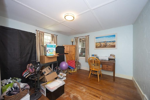 office space with wood finished floors and baseboards