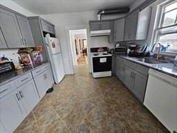7 Kensington Rd, Worcester, MA 01602 - kitchen with white appliances, under cabinet range hood, a sink, and gray cabinetry