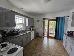 7 Kensington Rd, Worcester, MA 01602 - kitchen with white appliances, plenty of natural light, and a sink