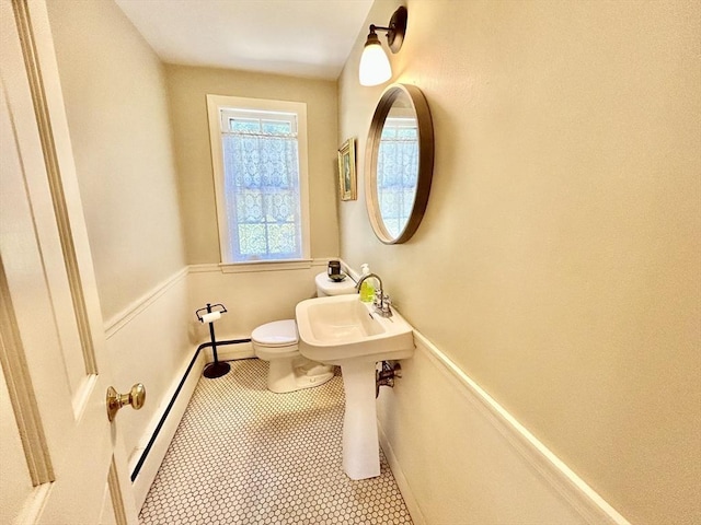 53 Washington St, Topsfield, MA 01983 - half bathroom with baseboard heating and tile patterned floors