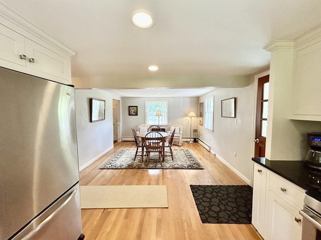 53 Washington St, Topsfield, MA 01983 - dining space with light wood-type flooring, recessed lighting, and a baseboard radiator