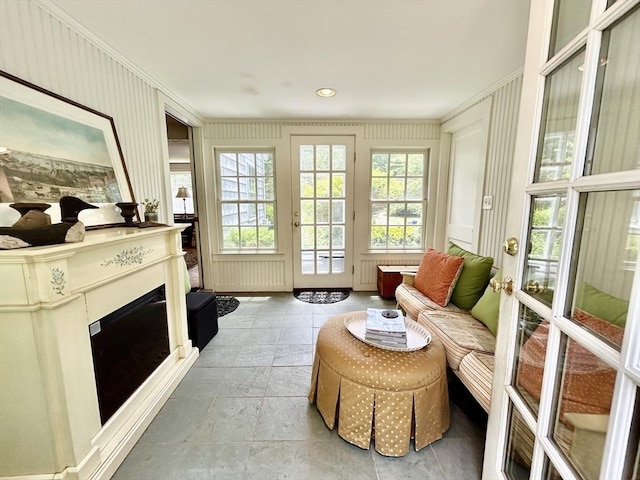 53 Washington St, Topsfield, MA 01983 - sunroom / solarium with plenty of natural light, a decorative wall, french doors, crown molding, and stone finish floors