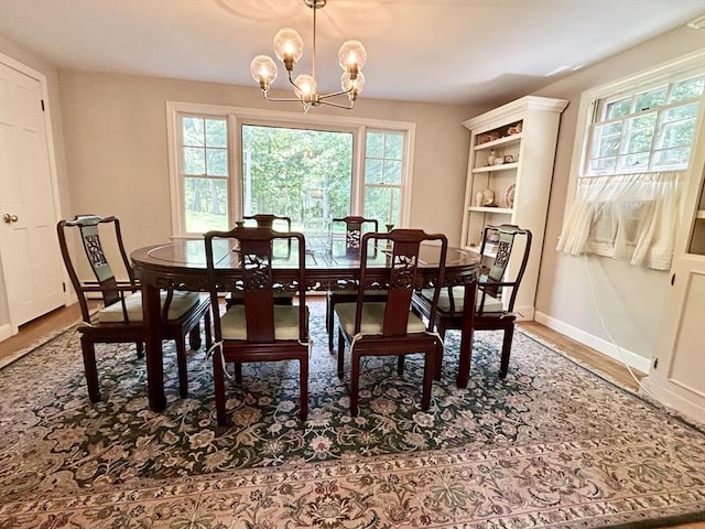 53 Washington St, Topsfield, MA 01983 - dining space featuring healthy amount of natural light, a chandelier, and wood finished floors
