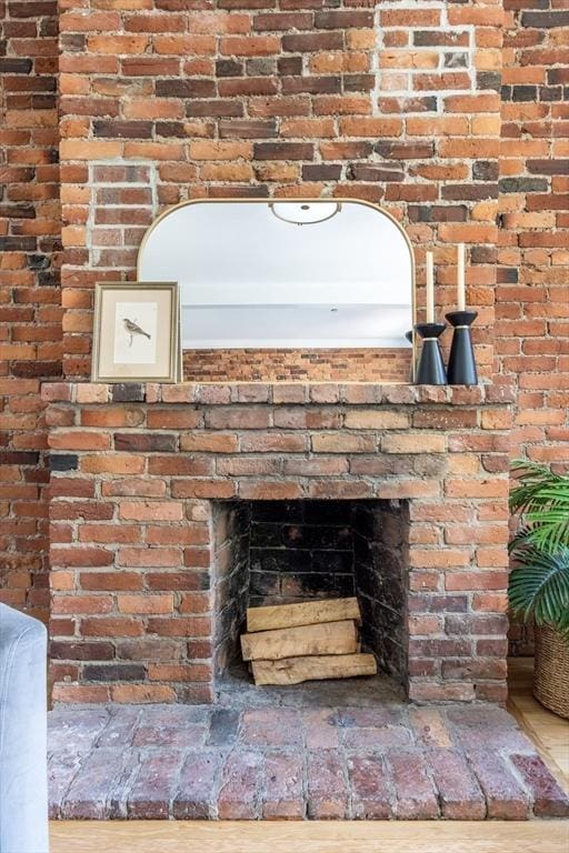 detailed view of a brick fireplace and brick wall