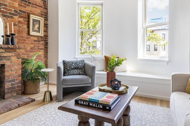 sitting room with wood finished floors and baseboards