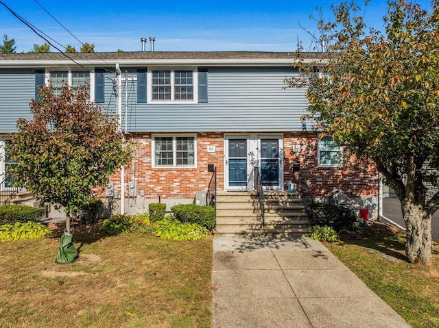 84 Lancaster Rd Unit 84, Dedham, MA 02026 - view of front of house featuring brick siding and a front lawn